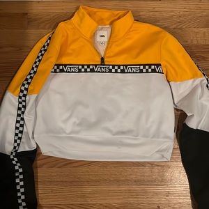 This Vans wind blocker is a crop-top and size medium in junior’s.